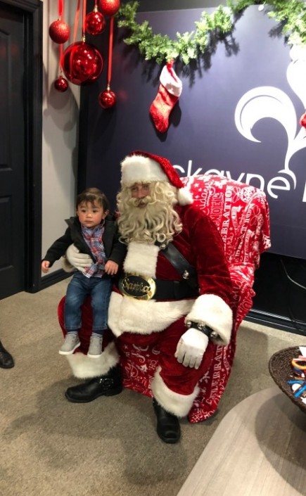 Santa with Kid at Christmas Celebration