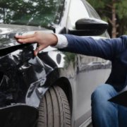 "Accident attorney negotiating with insurance adjuster on behalf of injured client after a car wreck"