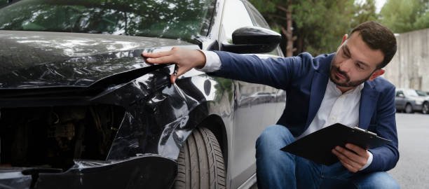 "Accident attorney negotiating with insurance adjuster on behalf of injured client after a car wreck"